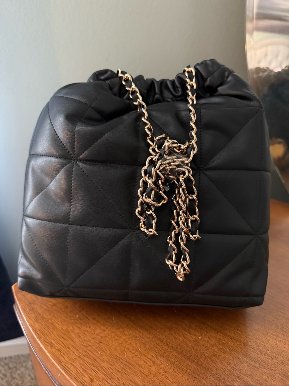 Black Quilted Drawstring Shoulder Bag with Gold Chain